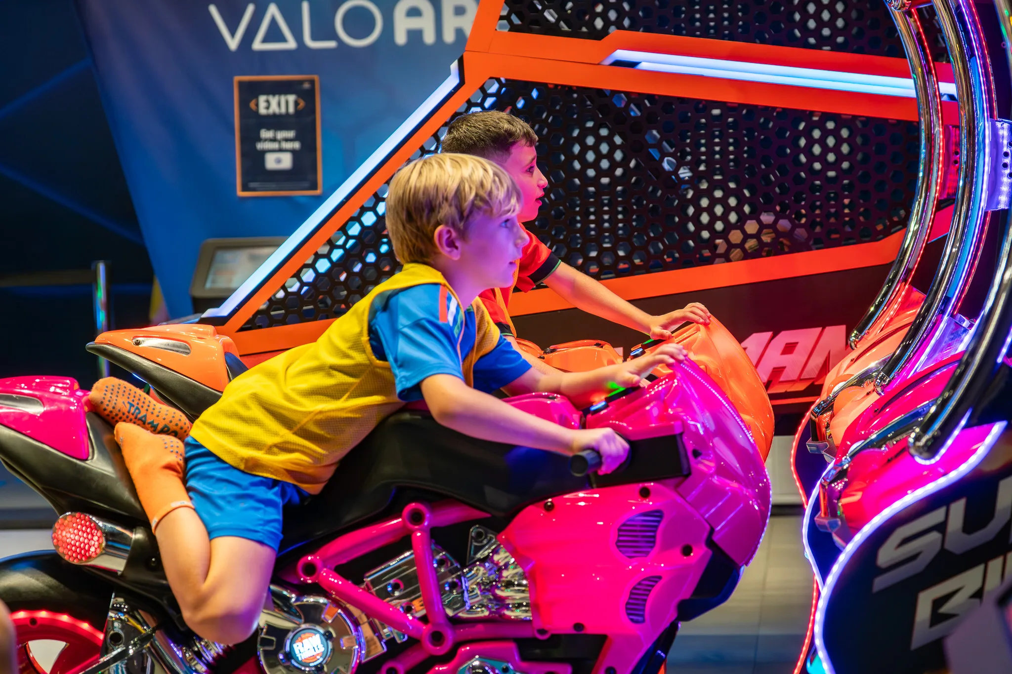 Claw machine and game card station at Trampo