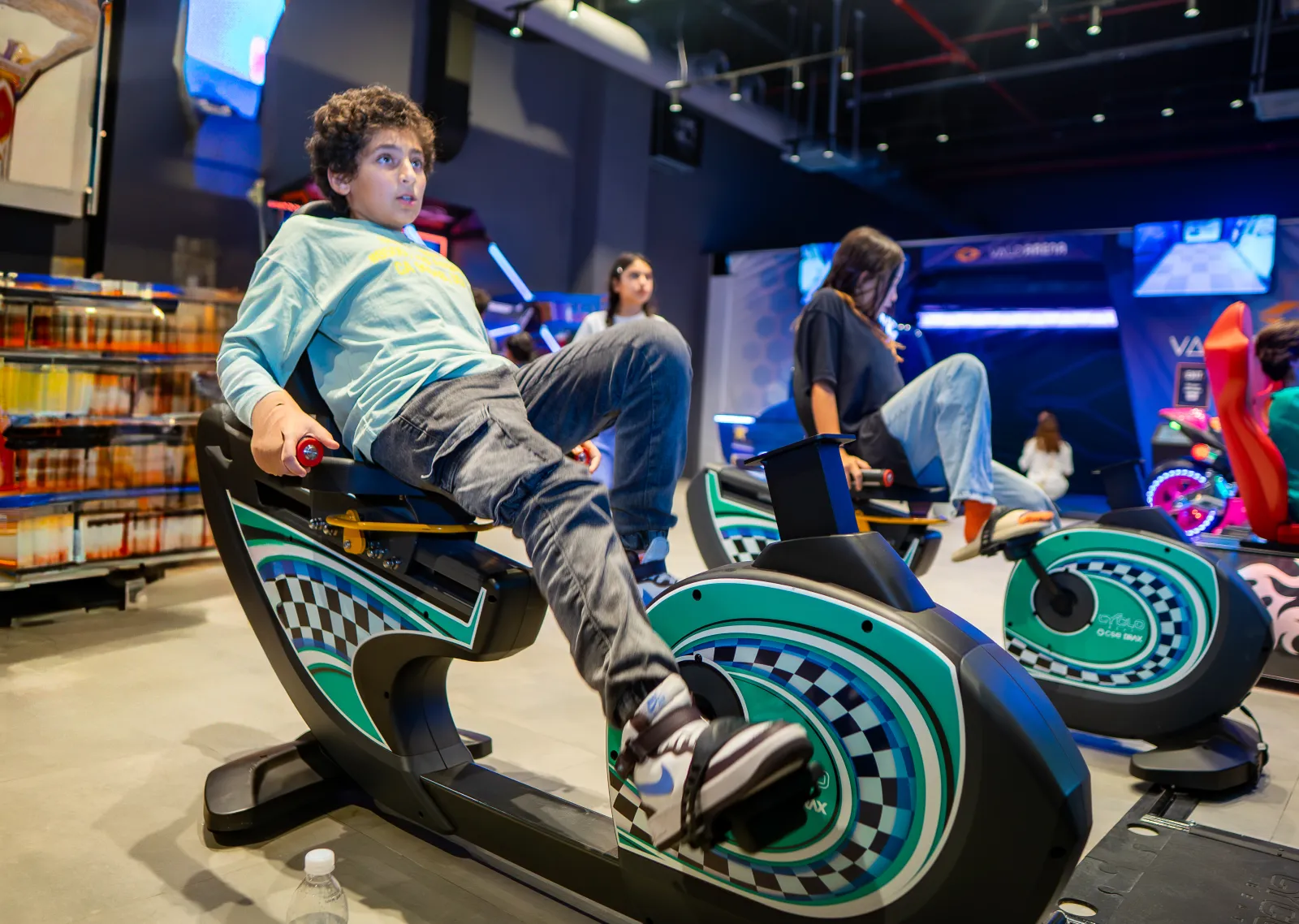 Kids at the arcade machines at Trampo