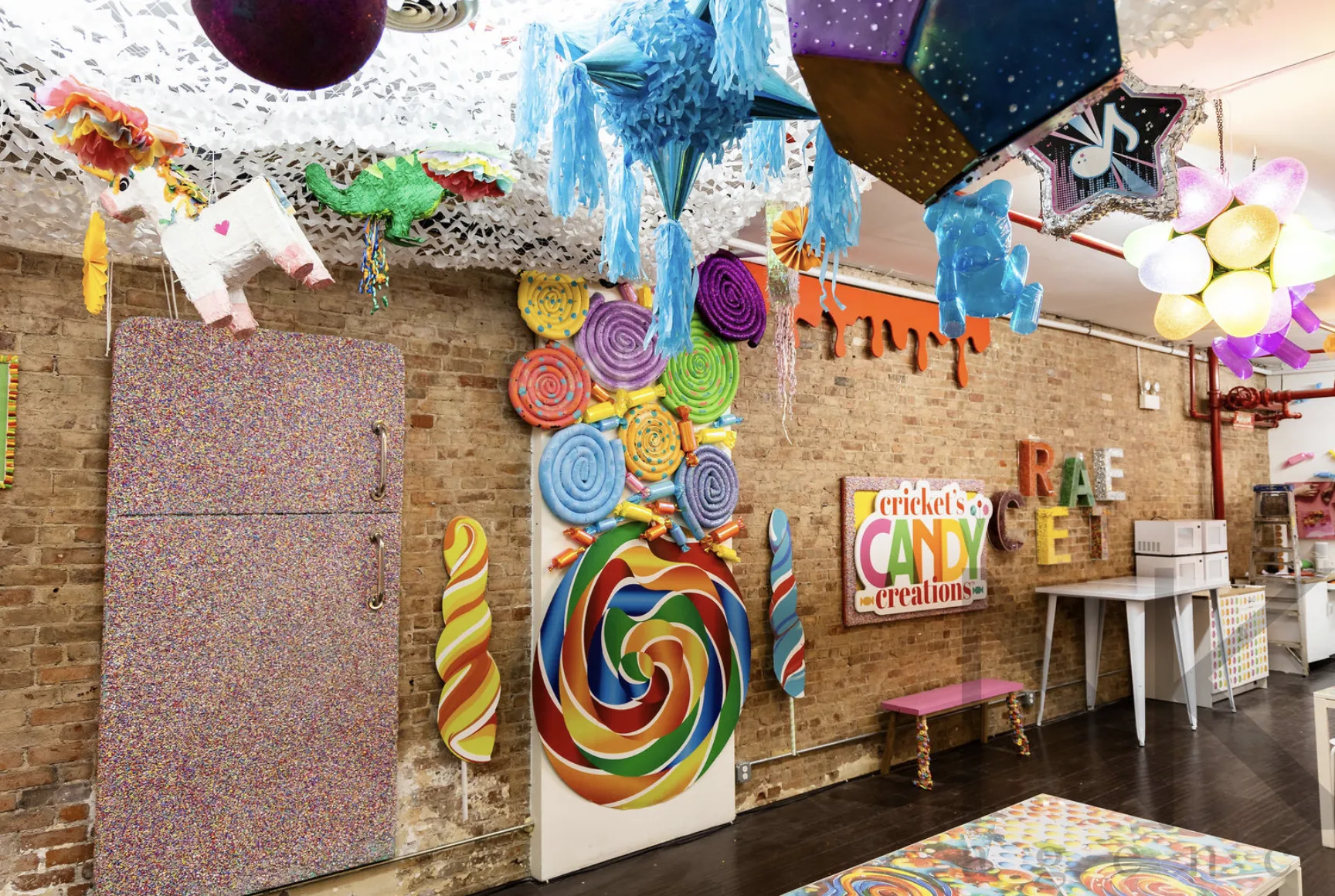Cricket's Candy Creations party studio with pinatas and candy art