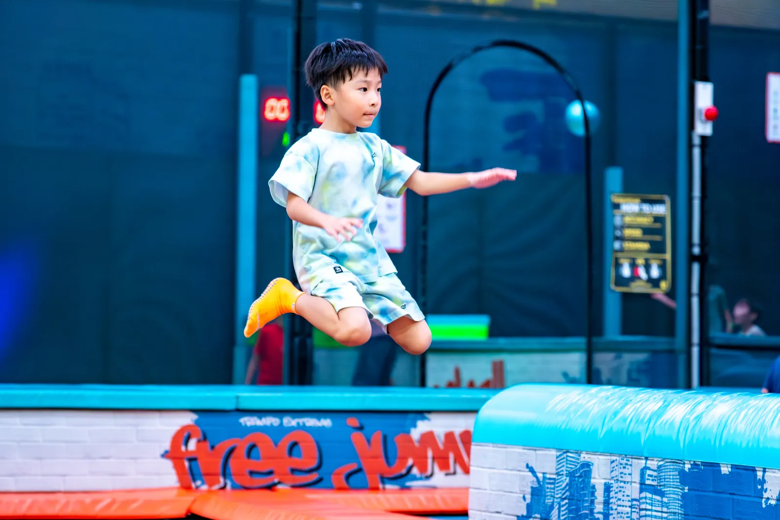Basketball slam dunk on spring trampolines at Trampo UAE