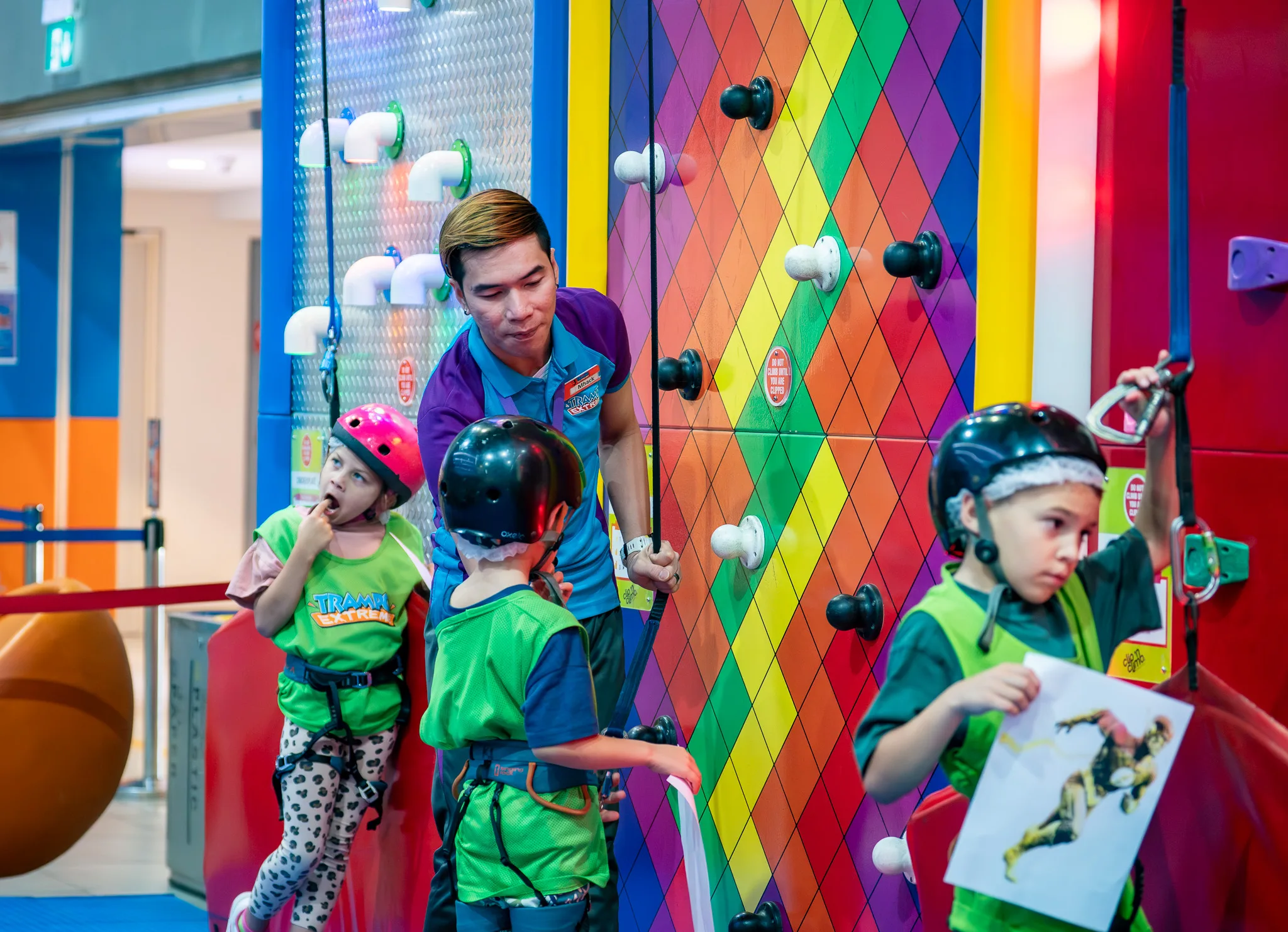 Climber on a colourful route at Trampo Dubai Mall
