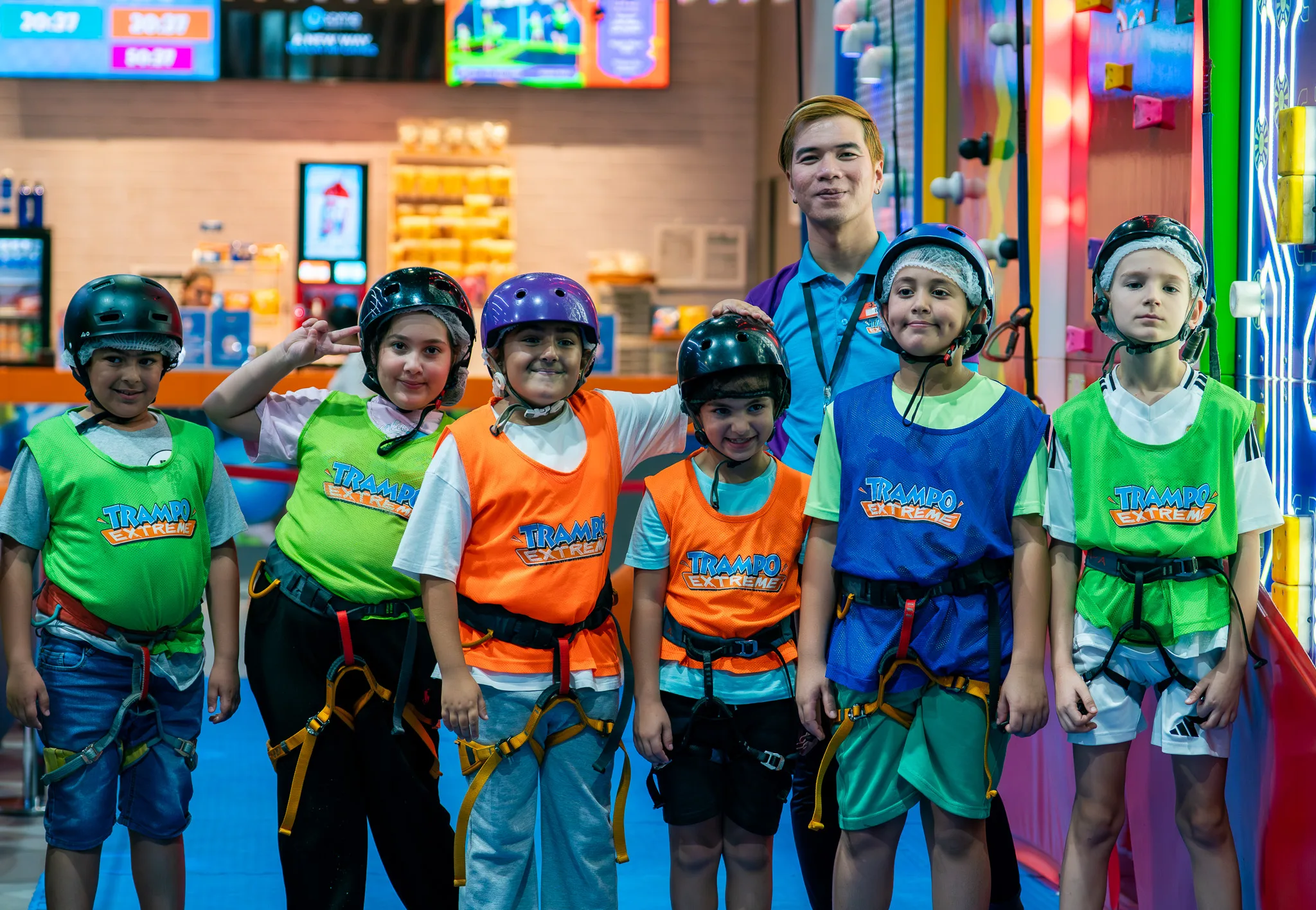 Group photo of climbers with safety harnesses at Trampo