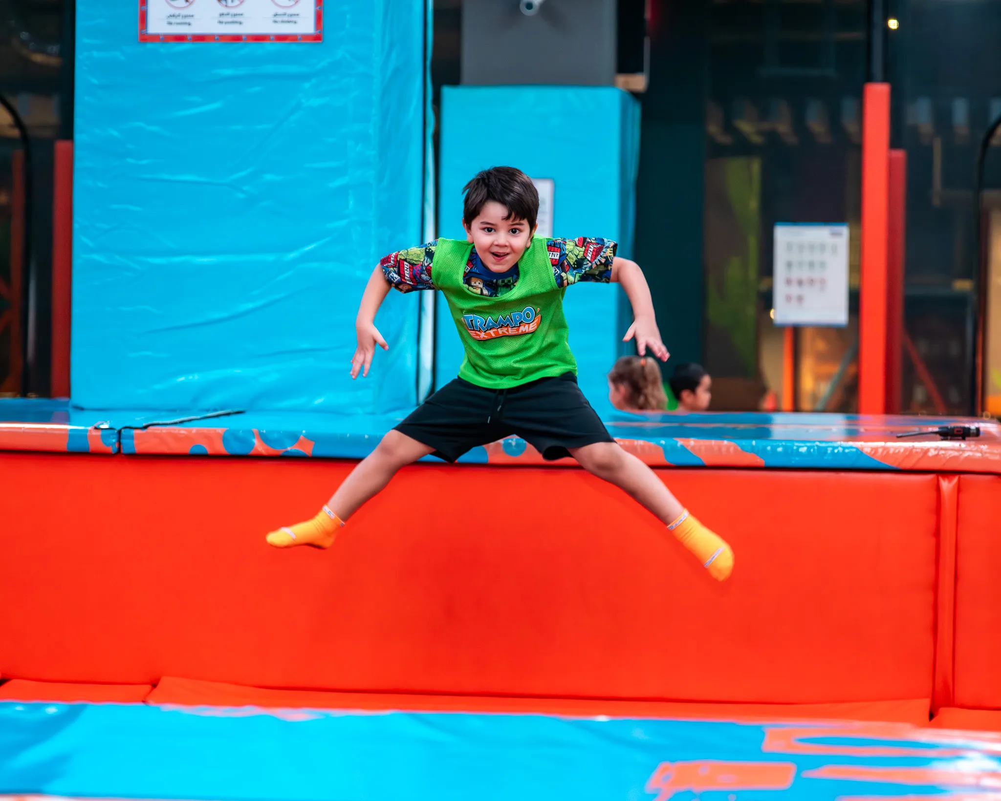 Boy jumping on trampoline